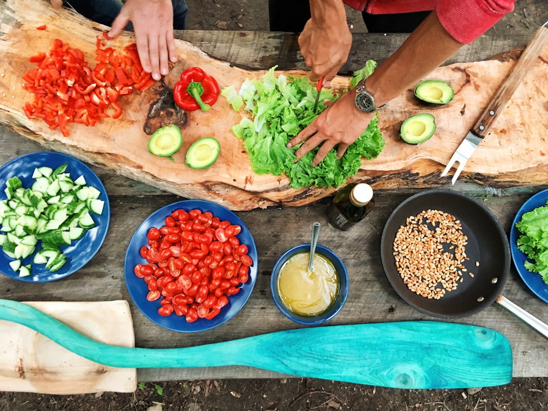 Students learning proper knife techniques and food preparation methods