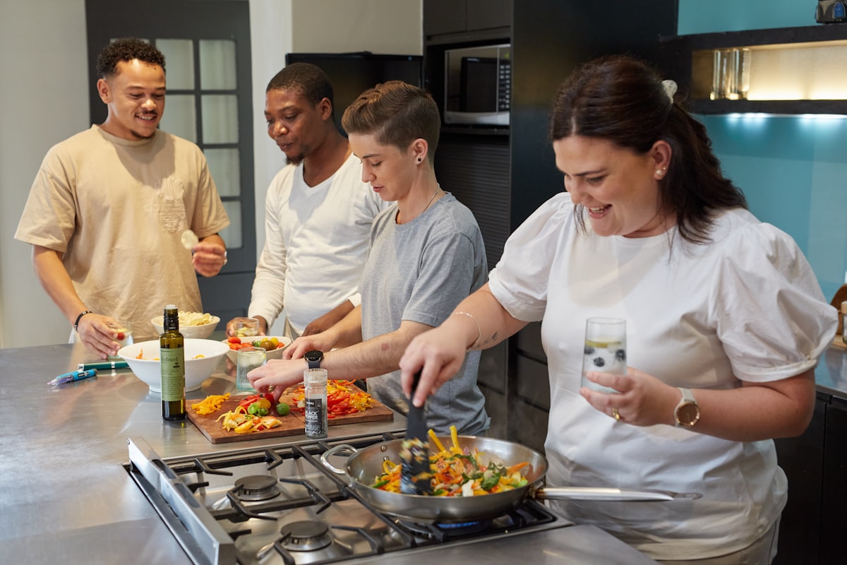 Cooking class participants learning from an experienced instructor